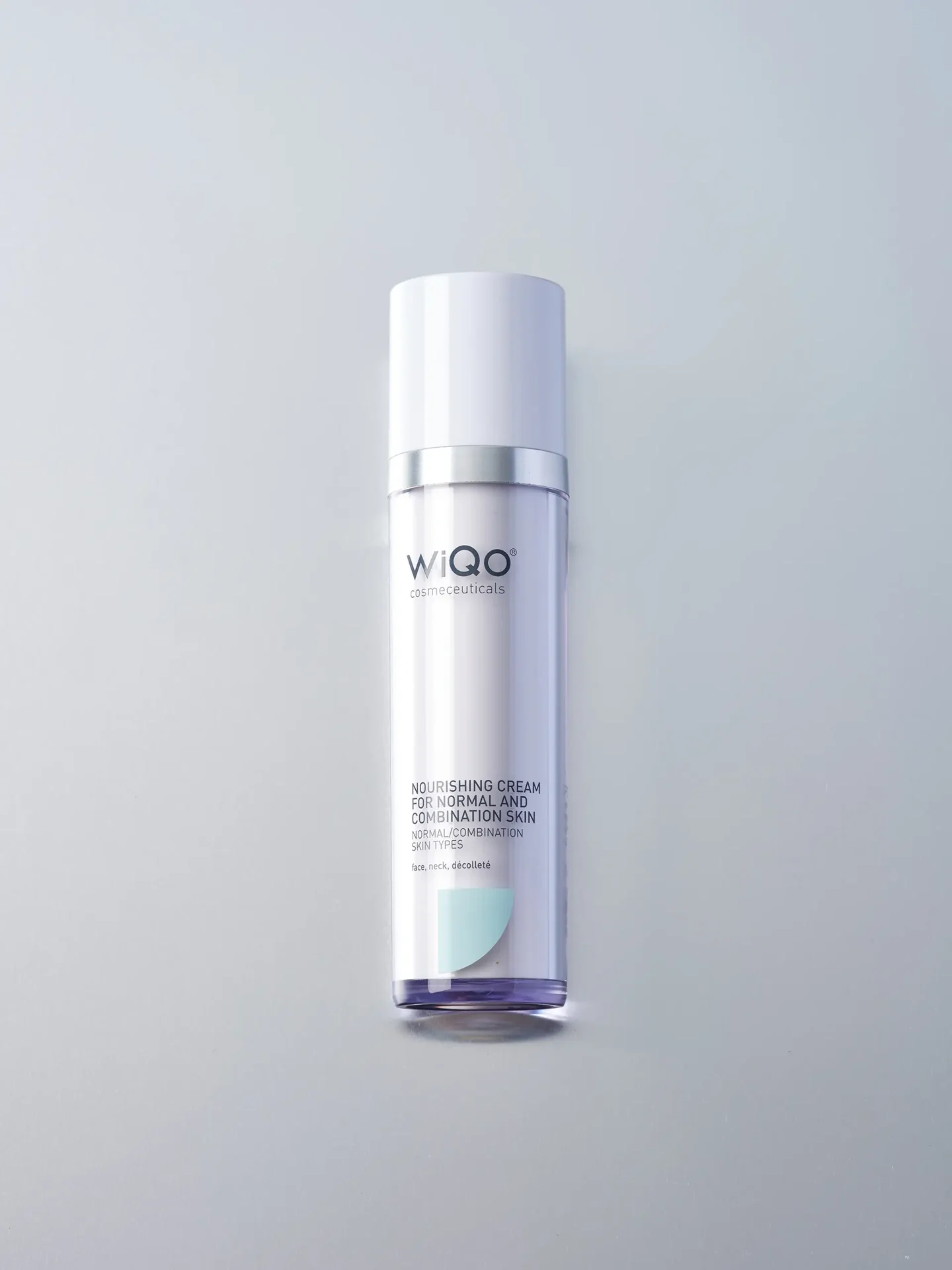 Bird eyes view product packshot of WiQo Nourishing Cream for Normal Skin on a ligh grey background